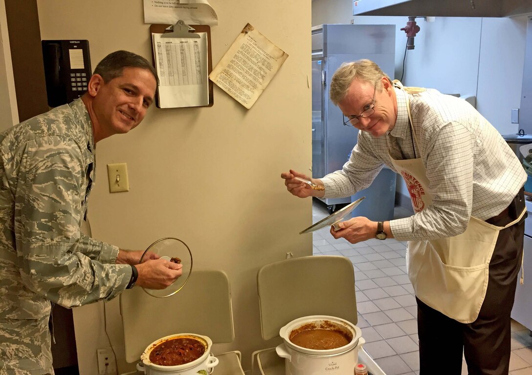 John Sheehan (right), director of customer operations in Subsistence, and Air Force Col. Glenn Chadwick, Industrial Hardware director, judge chili entries for the fifth annual Chili Cook-Off Nov. 15. The cook-off was part of a fundraising event for the 2016 Combined Federal Campaign. 