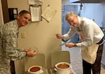 John Sheehan (right), director of customer operations in Subsistence, and Air Force Col. Glenn Chadwick, Industrial Hardware director, judge chili entries for the fifth annual Chili Cook-Off Nov. 15. The cook-off was part of a fundraising event for the 2016 Combined Federal Campaign. 