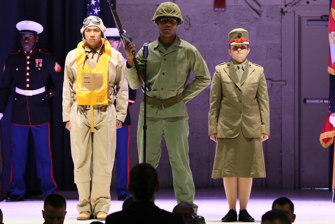 Lance Cpl. Lafayette Halmon (left), Lance Cpl. Adiel Garcia (center) and Lance Cpl. Melissa Dunbal (right), represent Marines in World War II during the annual Historic Uniform Pageant aboard Marine Corps Air Station Cherry Point, N.C., Nov. 4, 2016. The pageant is held to honor the Marine Corps’ birthday and features Marines wearing uniforms from all major conflicts the Marine Corps has fought in. The pageant depicts the Corps’ long illustrious history throughout decades of warfighting. The pageant also included a traditional cake-cutting ceremony representing the passing of traditions from the eldest Marine to the youngest. (U.S. Marine Corps photo by Lance Cpl. Mackenzie Gibson/Released)