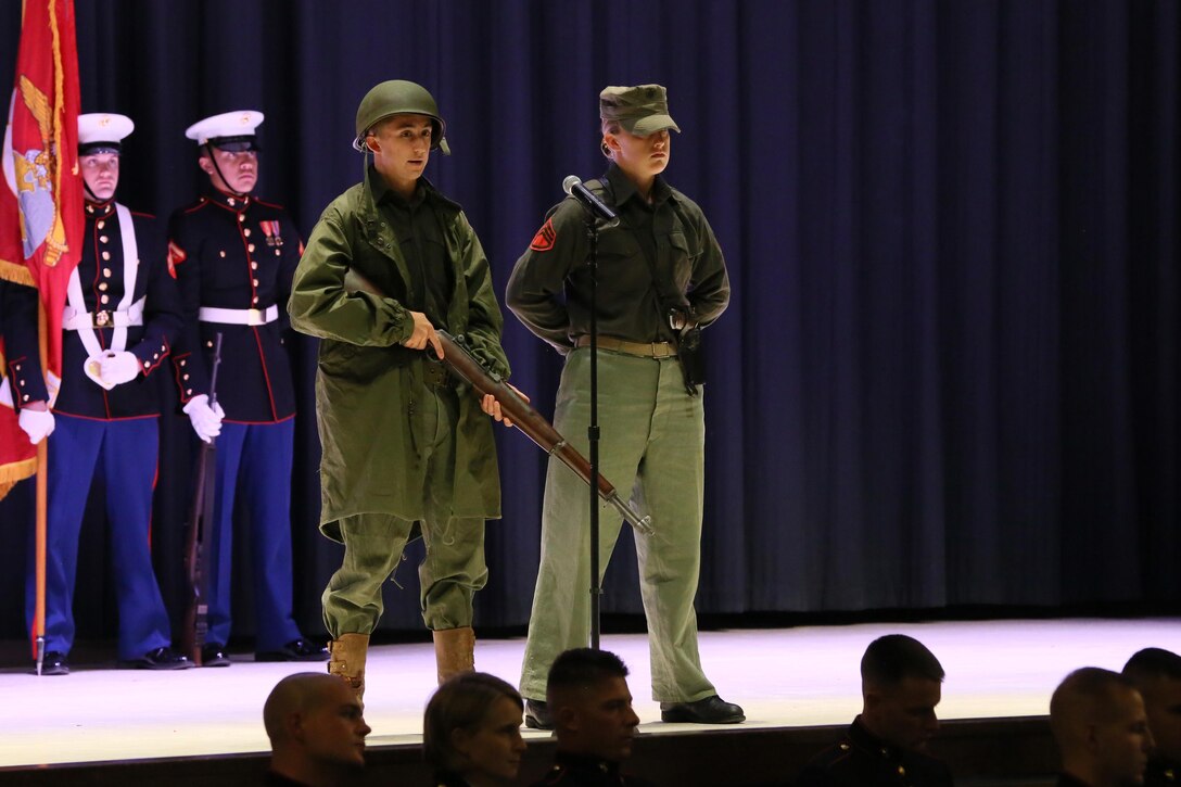 Lance Cpl. Trystan Davila (left) and Pfc. Michelle Smith represent Marines in the Korean War during the annual Historic Uniform Pageant aboard Marine Corps Air Station Cherry Point, N.C., Nov. 4, 2016. The pageant is held to honor the Marine Corps’ birthday and features Marines wearing uniforms from all major conflicts the Marine Corps has fought in. The pageant depicts the Corps’ long illustrious history throughout decades of warfighting. The pageant also included a traditional cake-cutting ceremony representing the passing of traditions from the eldest Marine to the youngest. (U.S. Marine Corps photo by Lance Cpl. Mackenzie Gibson/Released)