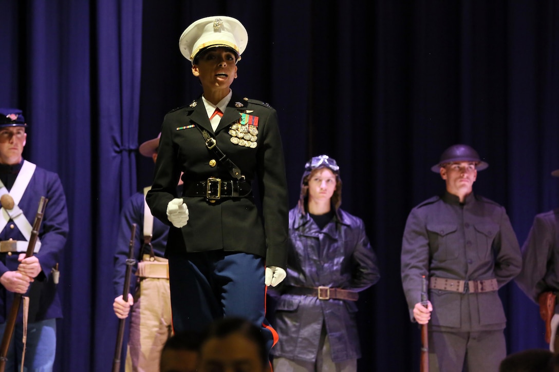 Capt. Deborah Myatt recites John A. Lejeune’s birthday message during the annual Historic Uniform Pageant aboard Marine Corps Air Station Cherry Point, N.C., Nov. 4, 2016. The pageant is held to honor the Marine Corps’ birthday and features Marines wearing uniforms from all major conflicts the Marine Corps has fought in. The pageant depicts the Corps’ long illustrious history throughout decades of warfighting. The pageant also included a traditional cake-cutting ceremony representing the passing of traditions from the eldest Marine to the youngest. Myatt is the MCAS Cherry Point adjutant. (U.S. Marine Corps photo by Lance Cpl. Mackenzie Gibson/Released)
