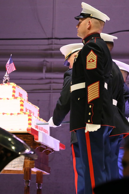 Col. Todd Ferry cuts the birthday cake during the annual Historic Uniform Pageant aboard Marine Corps Air Station Cherry Point, N.C., Nov. 4, 2016. The pageant is held annually to honor the Marine Corps’ birthday, and features Marines wearing uniforms from all major conflicts the Marine Corps has fought in. The pageant also included a traditional cake-cutting ceremony, where the first slice of cake is given to the oldest Marine present and passed to the youngest Marine to symbolize the experience and youthful spirit that are hallmarks of the Marine Corps. Ferry is the commanding officer of MCAS Cherry Point. (U.S. Marine Corps photo by Lance Cpl. Mackenzie Gibson/Released)