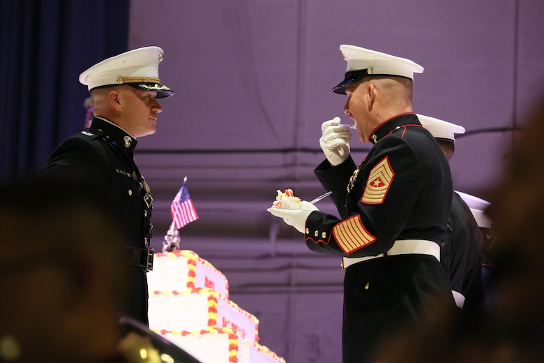 Sgt. Maj. Benjamin Pangborn takes a bite of the birthday cake during the annual Historic Uniform Pageant aboard Marine Corps Air Station Cherry Point, N.C., Nov. 4, 2016. The pageant is held annually to honor the Marine Corps’ birthday, and features Marines wearing uniforms from all major conflicts the Marine Corps has fought in. The pageant also included a traditional cake-cutting ceremony, where the first slice of cake is given to the oldest Marine present and passed to the youngest Marine to symbolize the experience and youthful spirit that are hallmarks of the Marine Corps. Pangborn is the MCAS Cherry Point sergeant major. (U.S. Marine Corps photo by Lance Cpl. Mackenzie Gibson/Released)
