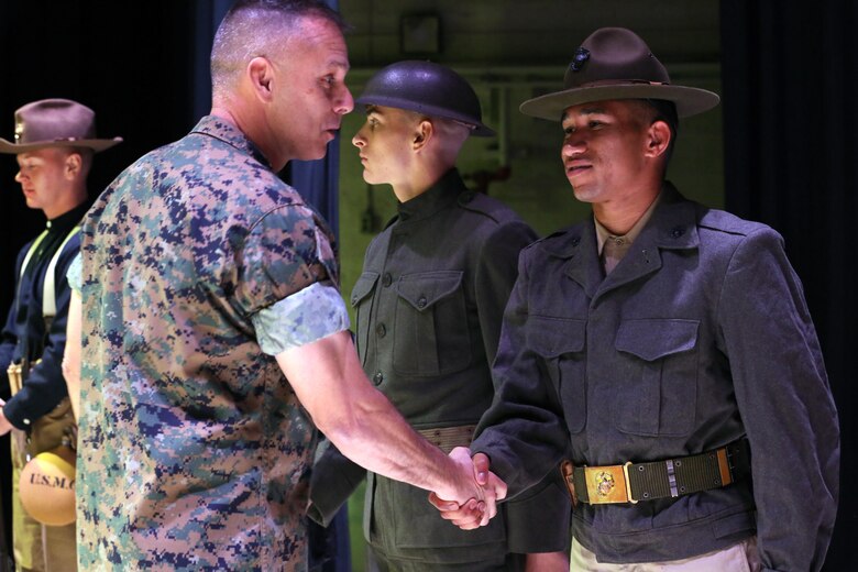 Brig. Gen. Matthew Glavy shakes hands with a Marine participating in the annual Historic Uniform Pageant aboard Marine Corps Air Station Cherry Point, N.C., Nov. 4, 2016. The pageant is held to honor the Marine Corps’ birthday and features Marines wearing uniforms from all major conflicts the Marine Corps has fought in. The pageant depicts the Corps’ long illustrious history throughout decades of warfighting. The pageant also included a traditional cake-cutting ceremony representing the passing of traditions from the eldest Marine to the youngest. Glavy is the 2nd Marine Aircraft Wing commanding general. (U.S. Marine Corps photo by Lance Cpl. Mackenzie Gibson/Released)