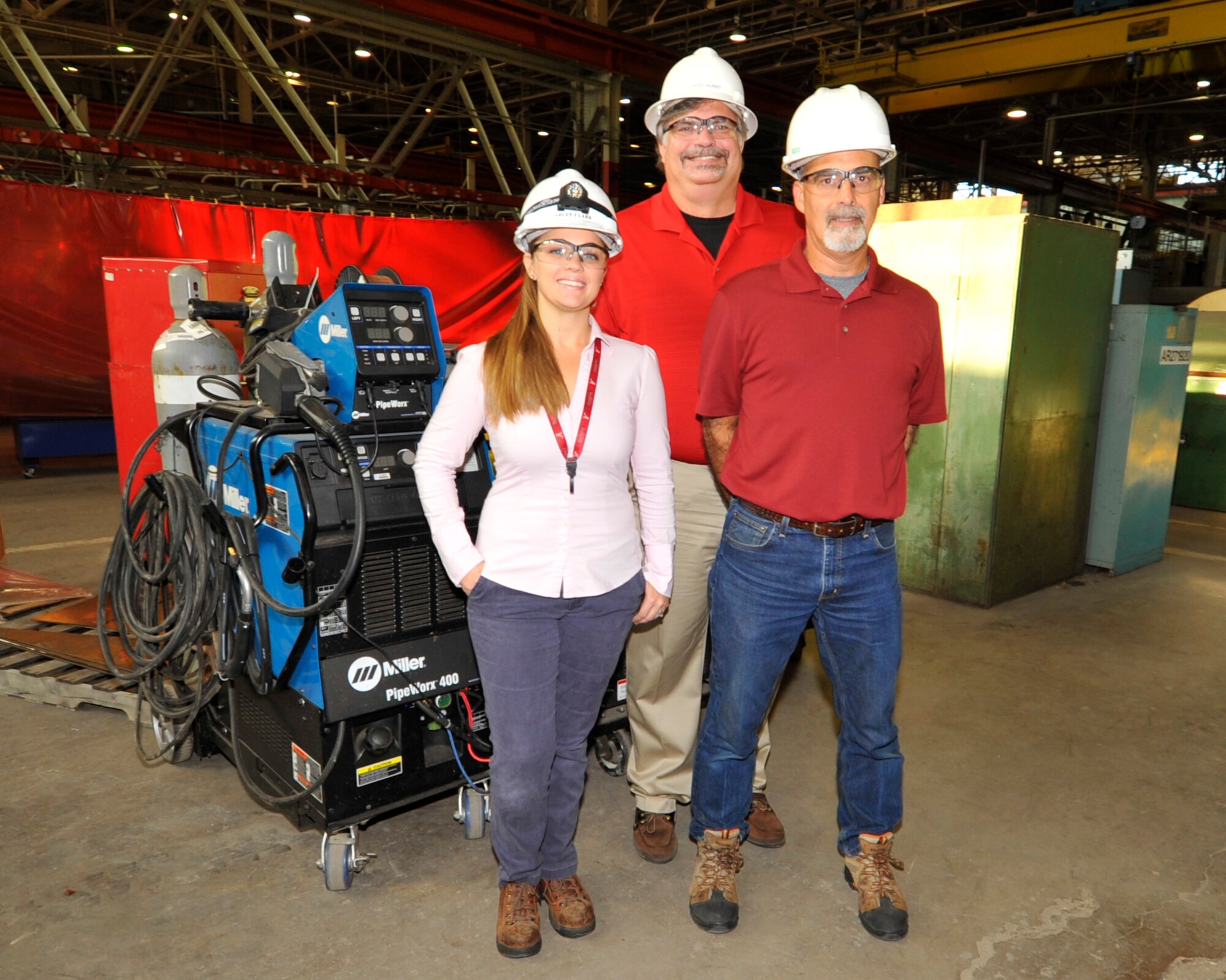 David Hurst, Asset Health Assurance Group Manager for the AEDC Model and Machine Shop, recently recognized Ashley Clark, left, and Tracy McDonald, for their efforts in reducing the cost of the preventative maintenance program for welding machines. Their work will lead to a savings over the life of the contract of approximately $200,000.