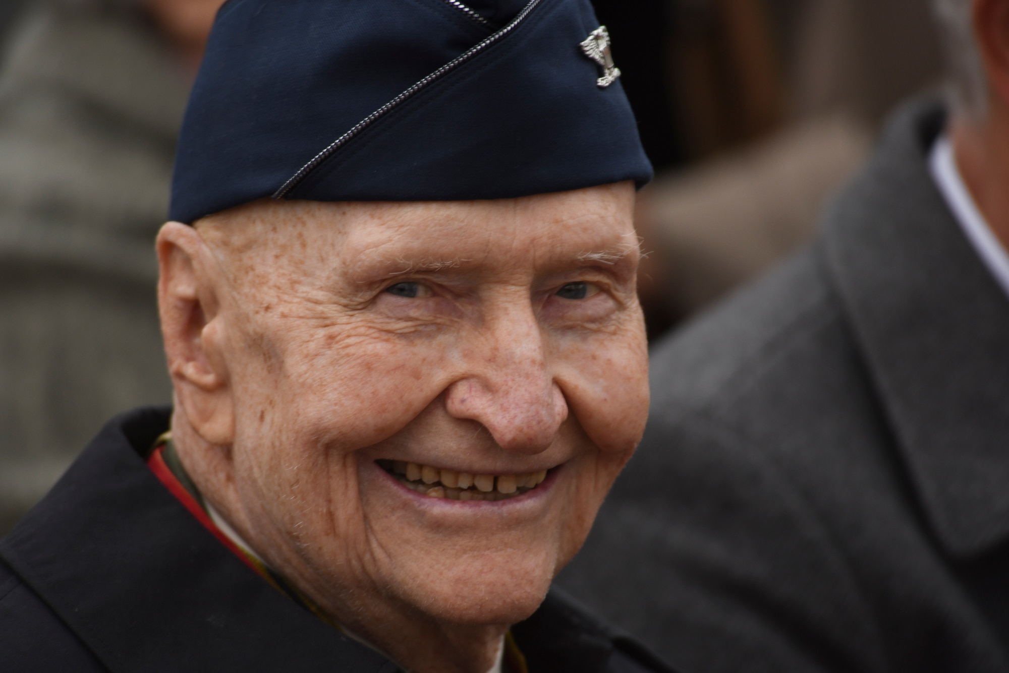 Retired U.S. Air Force Col. Gail Halvorsen, a C-52 Skymaster pilot also known as the Candy Bomber, smiles during the reopening ceremony of the Berlin Airlift Memorial outside Frankfurt International Airport, Germany, Nov. 22, 2016. Halvorsen and his fellow pilots dropped 23 tons of candy with makeshift parachutes from his C-54 as part of the Berlin Airlift, which delivered more than two million tons of food to the blockaded citizens of West Berlin between June 1948 and September 1949. (U.S. Air Force photo by Staff Sgt. Joe W. McFadden)