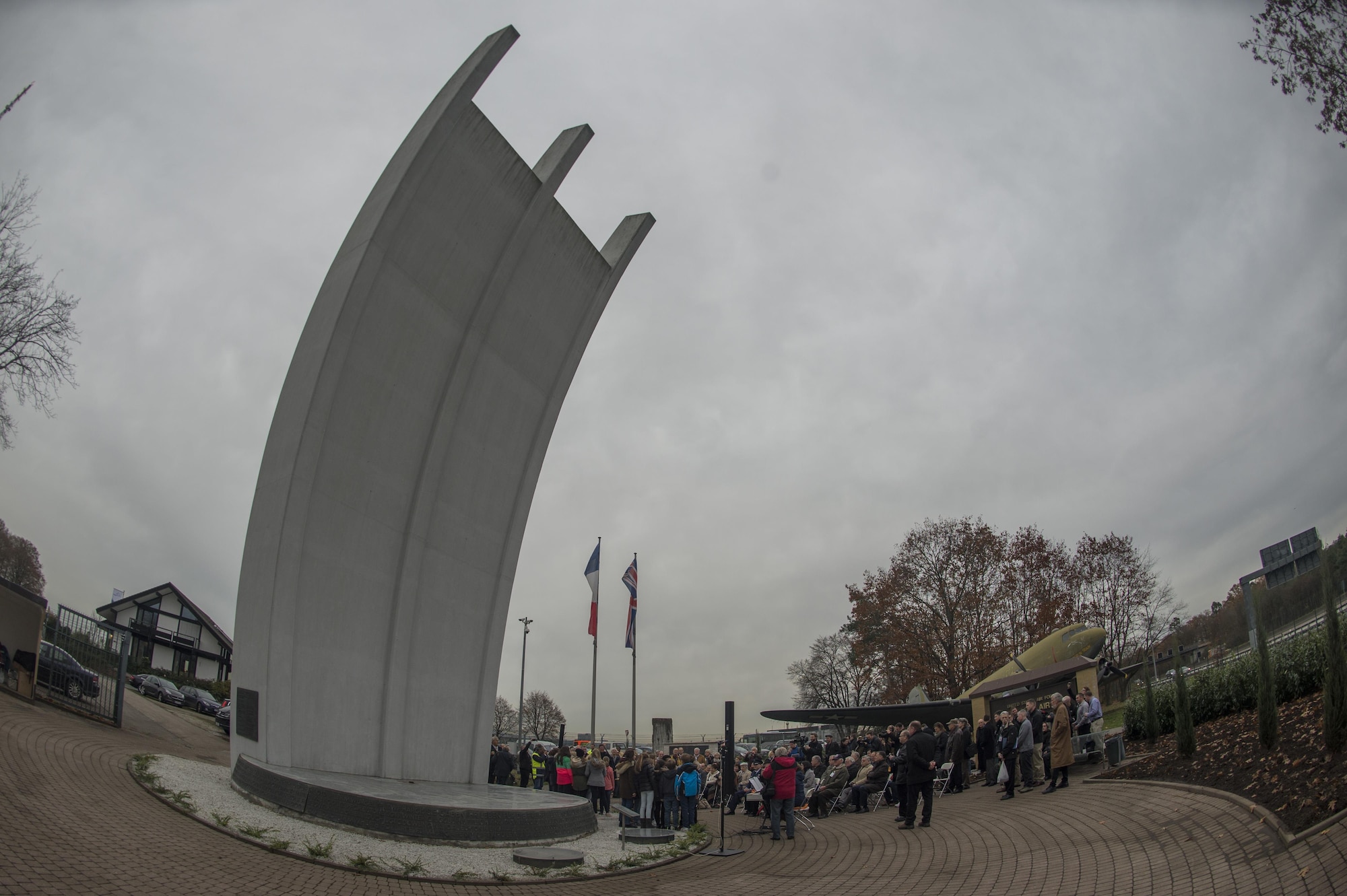 Dozens of Germans and Americans gather for the reopening ceremony of the Berlin Airlift Memorial at Frankfurt International Airport, Germany, Nov. 22, 2016. The memorial, which features a corresponding tower in Berlin, Germany, commemorates the two launchpads for the humanitarian airlift conducted by the U.S. and British air forces to deliver food and supplies to the blockaded citizens of West Berlin between June 1948 and September 1949. (U.S. Air Force photo by Staff Sgt. Joe W. McFadden)