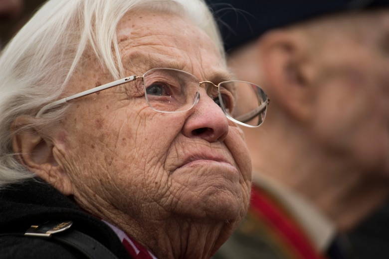 Gisela Rainare, a former civilian employee at the former Frankfurt an Main Air Base, Germany, listens to music during the reopening ceremony of the Berlin Airlift Memorial outside Frankfurt International Airport, Germany, Nov. 22, 2016. Rainare worked as part of the Berlin Airlift, also known as Operation Vittles, which delivered more than two million tons of food to the blockaded citizens of West Berlin between June 1948 and September 1949. (U.S. Air Force photo by Staff Sgt. Joe W. McFadden)