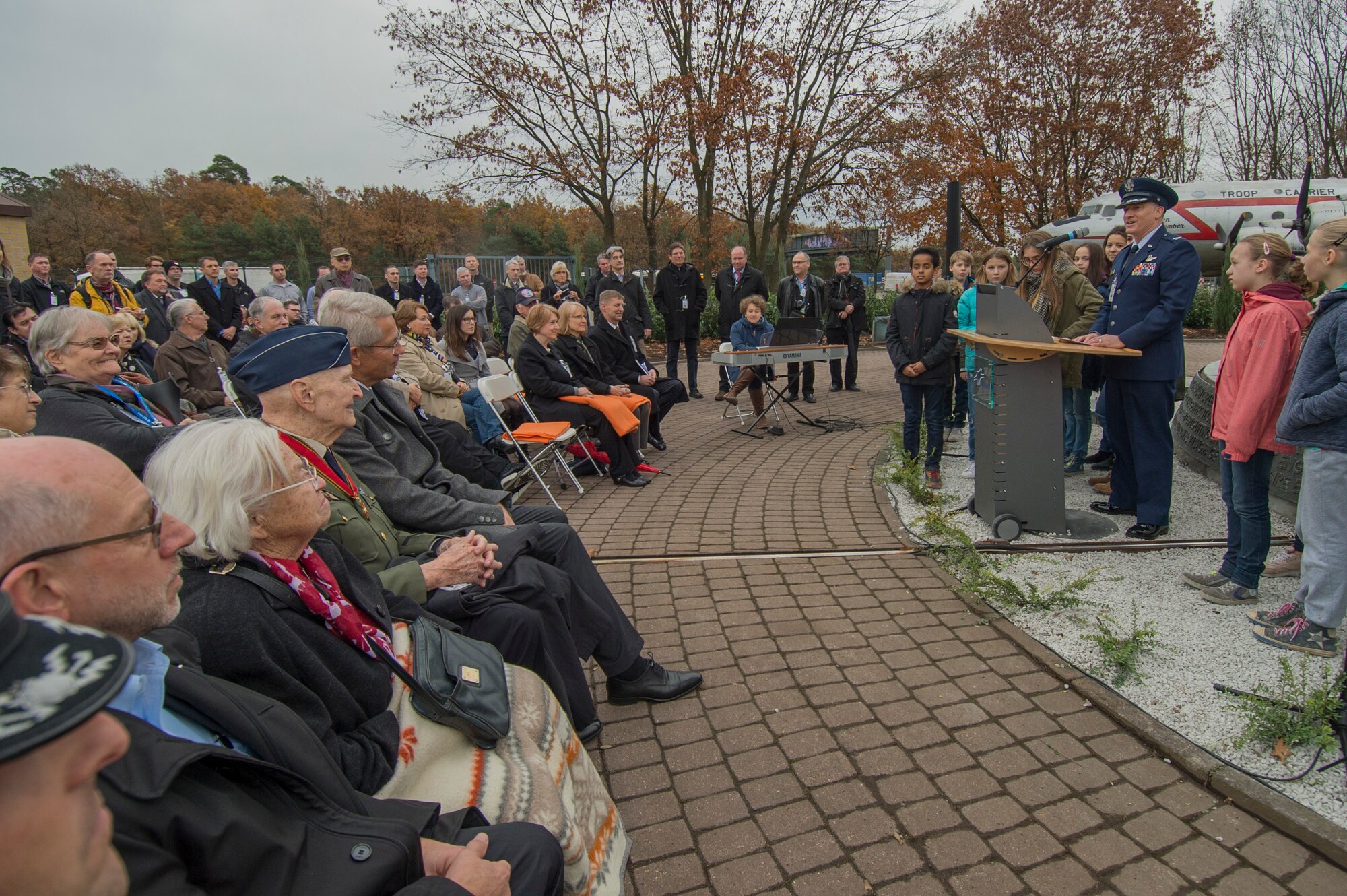 U.S. Air Force Col. Timothy Stretch, U.S. Air Forces Europe representative on behalf of the commander, speaking during the reopening ceremony of the Berlin Airlift Memorial outside Frankfurt International Airport, Germany, Nov. 22, 2016. The ceremony included retired U.S. Air Force Col. Gail Halvorsen, also known as the Candy Bomber, who dropped 23 tons of candy with makeshift parachutes from his C-54 Skymaster as part of the humanitarian supply mission. The Berlin Airlift, also known as Operation Vittles, delivered more than two million tons of food to the blockaded citizens of West Berlin between June 1948 and October 1949. (U.S. Air Force photo by Staff Sgt. Joe W. McFadden)