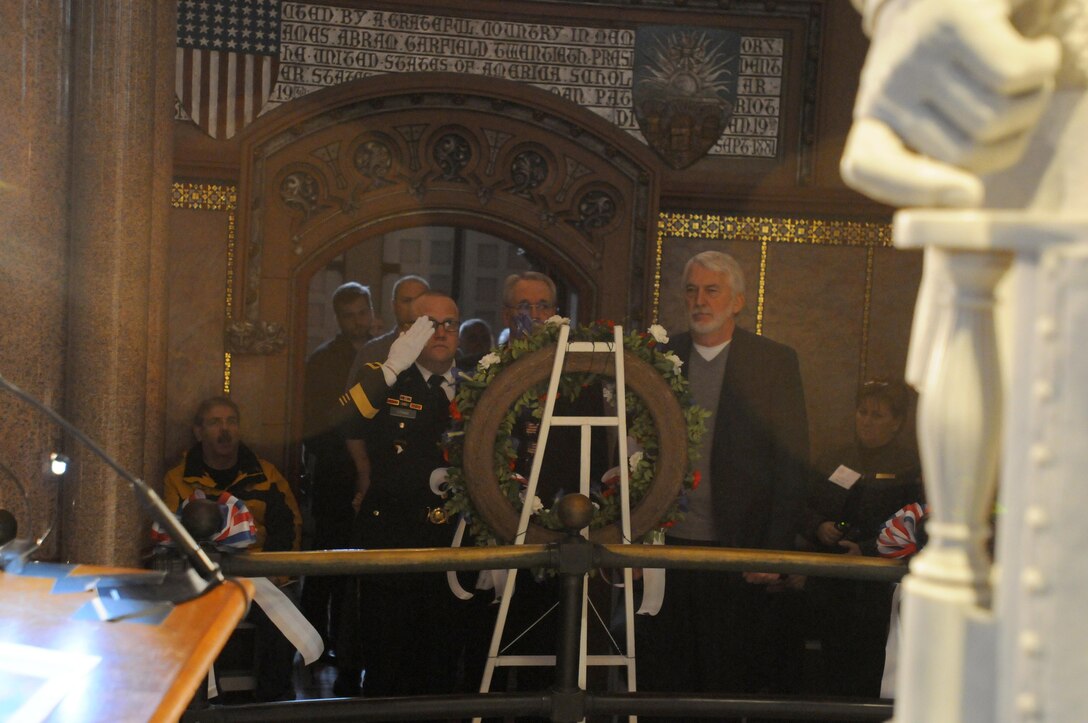 CLEVELAND (November 19, 2016) – Brigadier Gen. Stephen E. Strand, saluting, deputy commanding general for the 88th Regional Support Command and representing President Barack Obama, and Tim Garfield, the great-great grandson of the former president, along with other surviving members of the Garfield family presented the wreath at the base of the James A. Garfield Memorial during the wreath laying ceremony honoring what would have been the 185th birthday of the 20th President of the United States.