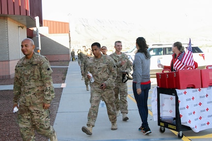 More than 100 Soldiers from the 369th Chemical Company based out of Fort Bliss, Texas, returned from a nine-month deployment to Kuwait November 14.  76th Division Operational Response Deputy Commanding General, Brig. Gen. James Blankenhorn, and Command Sgt. Maj. Michael Robinson, were on hand to welcome the Soldiers as they walked down from the chartered airplane.