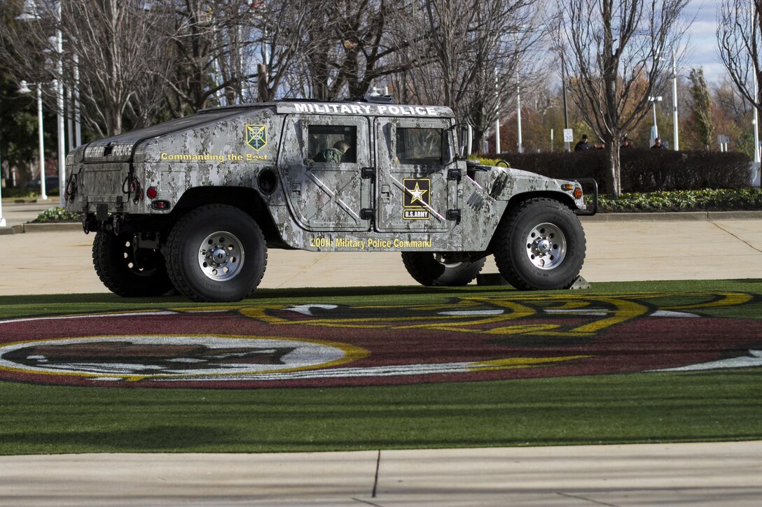A 200th Military Police Command High Mobility Multipurpose Wheeled Vehicle (HMMWV) is displayed outside Fedex Field in Landover, Maryland, Nov. 20. The 200th MP Command had several HMMWVs and an armored security vehicle on display at Fedex Field, among other various military displays, as part of the NFL's Military Appreciation game. U.S. Army Reserve and Active Duty MP Soldiers showcased static displays prior to the game to provide the public an opportunity to learn more about the MP career field. (U.S. Army Reserve photo by Sgt. Jennifer Spiker)