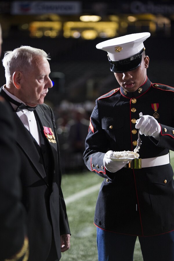 Pfc. Deshontae D. Bean, admin specialist, 4th Marine Logistics Group, is presented the third piece of cake as the youngest Marine present during the Marine Forces Reserve birthday ball at the Mercedes-Benz Superdome. Nov. 19, 2016. Bean enlisted in the Marine Corps in May 2016 and reported to Marine Corps Recruit Depot San Diego for recruit training. Each year, a ball is hosted to celebrate the birthday of the Corps and to remember Marines who have given the ultimate sacrifice. Since its establishment in 1775, the Marine Corps has fought and won our nation’s battles. (U.S. Marine Corps photo by Cpl. Melissa Martens/ Released) 
