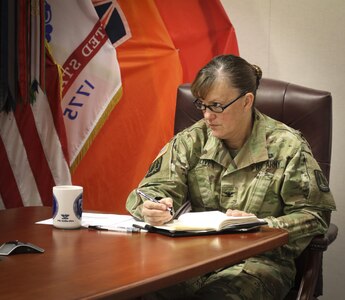 Col. Nikki Olive-Griffin, deputy commanding general of sustainment, 335th Signal Command (Theater) listens intently to a guest speaker at the 335th SC (T) headquarters Nov. 21, during a Substance Abuse Action Meeting.  The meeting provided attendees with an opportunity for two-way communication and consultation with representatives from the Atlanta Veterans Affairs Medical Center and an Alcohol and Drug Control Officer from the 3rd Medical Command (Deployment Support).