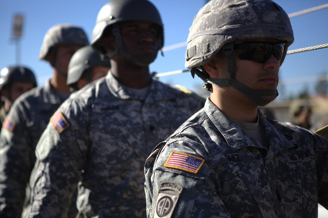 U.S. Army 1st Lt. Rodolfo Saez, of the 982nd Combat Camera Company, stands with fellow U.S. Army soldiers during aircraft drill refresher exercises, at March Air Reserve Base, Riverside Cali., November 18, 2016.  Exercise TOPHAM is a multinational Airborne exercise hosted by the 426th Civil Affairs Battalion at March Air Reserve Base and Camp Pendleton, Calif., with field exercises on Civil Military Operations Center and Civil Information Management key collective tasks. (U.S. Army photo by Sgt. Phillip McTaggart/Released)