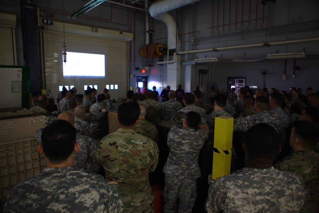 U.S. Army soldiers attend a briefing at March Air Reserve Base, Riverside Calif., November 18, 2016.  Exercise TOPHAM is a multinational Airborne exercise hosted by the 426th Civil Affairs Battalion at March Air Reserve Base and Camp Pendleton, Calif., with field exercises on Civil Military Operations Center and Civil Information Management key collective tasks. (U.S. Army photo by Sgt. Phillip McTaggart/Released)