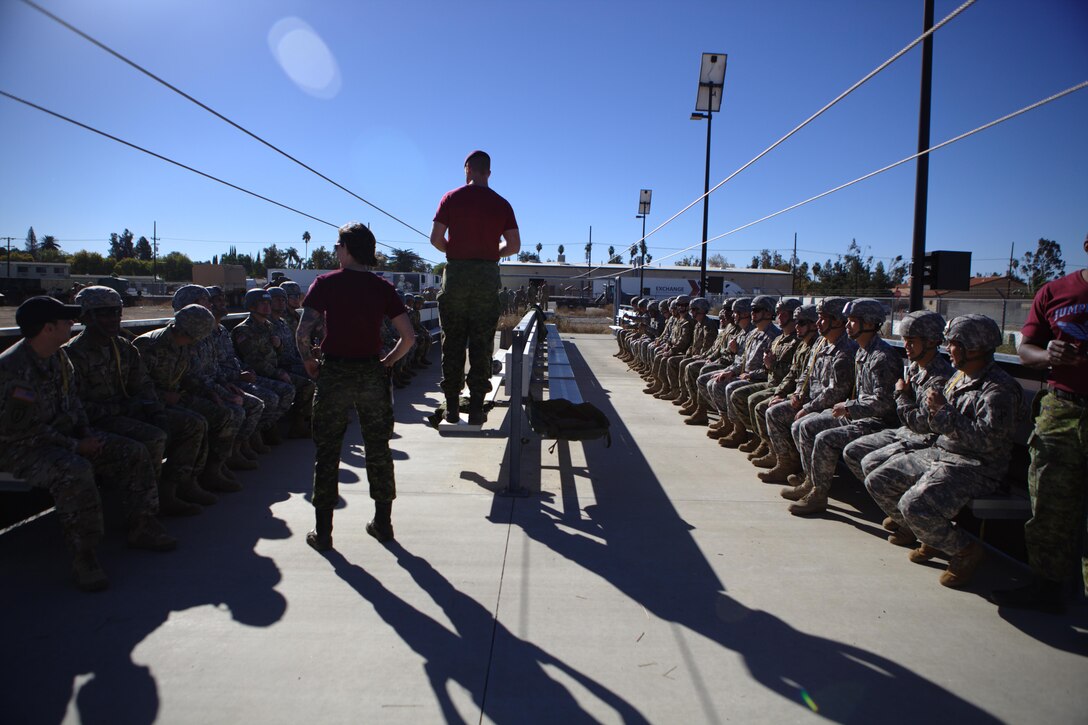 Army soldiers of the Queen's Own Rifles of Canada, instructs U.S. Army soldiers in aircraft drill refresher exercises, at March Air Reserve Base, Riverside Calif., November 18, 2016. Exercise TOPHAM is a multinational Airborne exercise hosted by the 426th Civil Affairs Battalion at March Air Reserve Base and Camp Pendleton, Calif., with field exercises on Civil Military Operations Center and Civil Information Management key collective tasks. (U.S. Army photo by Sgt. Phillip McTaggart/Released)