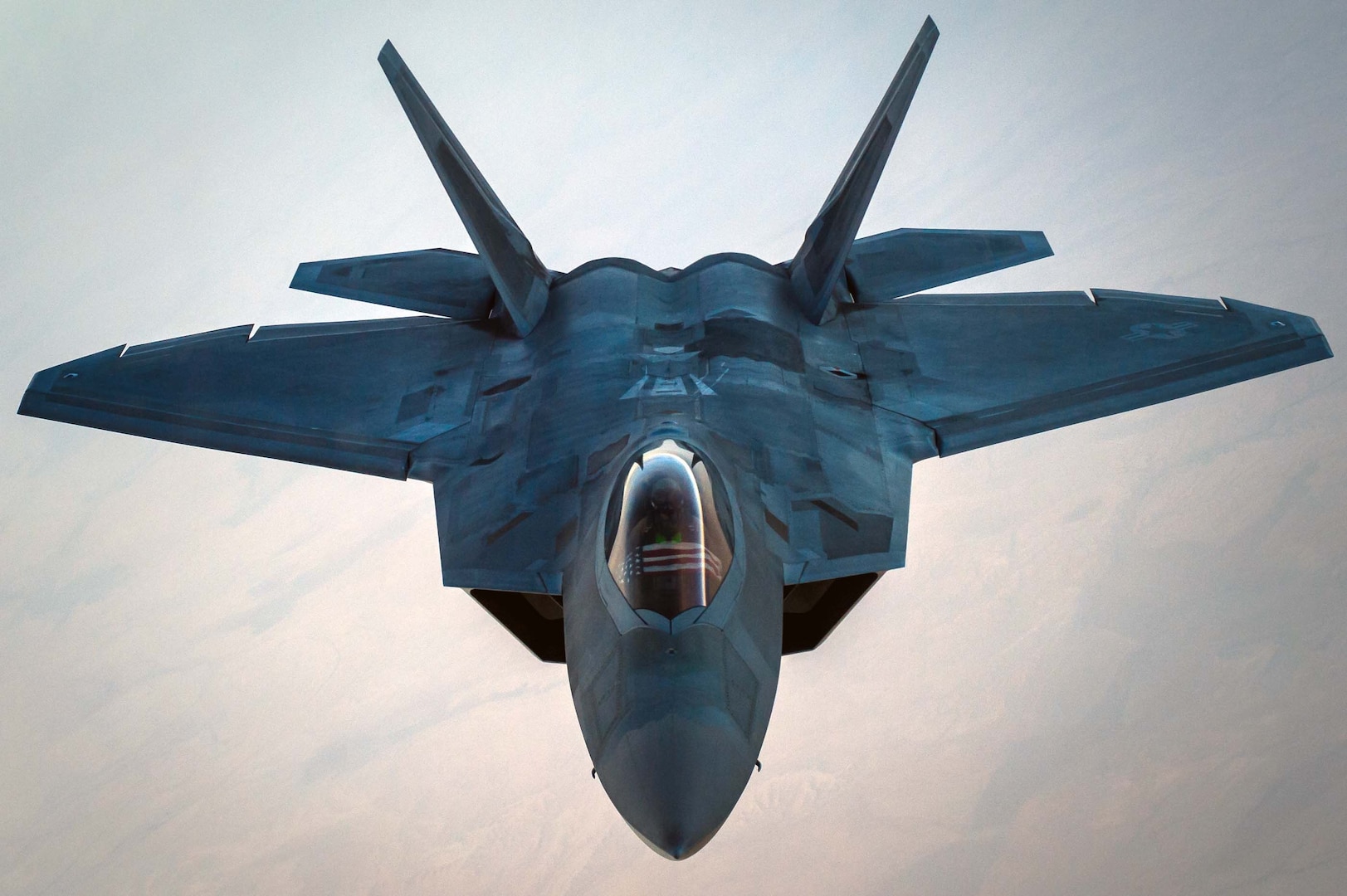A U.S. Air Force F-22 Raptor separates from a KC-10 Extender after refueling over an undisclosed location in Southwest Asia, Oct. 26, 2016. The F-22s are providing strategic close air support with several other Coalition airframes working to liberate the city of Mosul, Iraq and have also performed approximately half (51%) of all escort missions in Operation Inherent Resolve. (U.S. Air Force photo by Senior Airman Tyler Woodward)