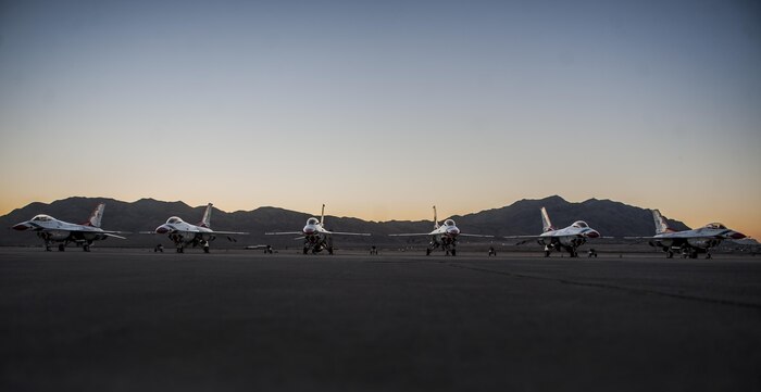 The U.S. Air Force Thunderbirds Air Demonstration Squadron’s F-16s sit on the flightline at Nellis Air Force Base, Nev., before Aviation Nation, Nov. 11, 2016. The Air Force Thunderbirds demonstrate the capabilities of the Air Force and the decisive combat power Airmen bring to threats against the U.S. (U.S. Air Force photo by Airman 1st Class Kevin Tanenbaum/Released)