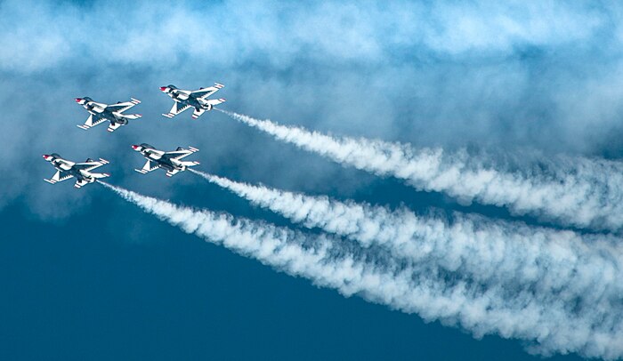 Four U.S. Air Force Thunderbirds Air Demonstration Squadron aircraft fly in a close-air formation during Aviation Nation on Nellis Air Force Base, Nev., Nov. 11, 2016. The Thunderbirds are a demonstration team who display the pride, precision and professionalism of American Airmen. (U.S. Air Force photo by Airman 1st Class Kevin Tanenbaum/Released)