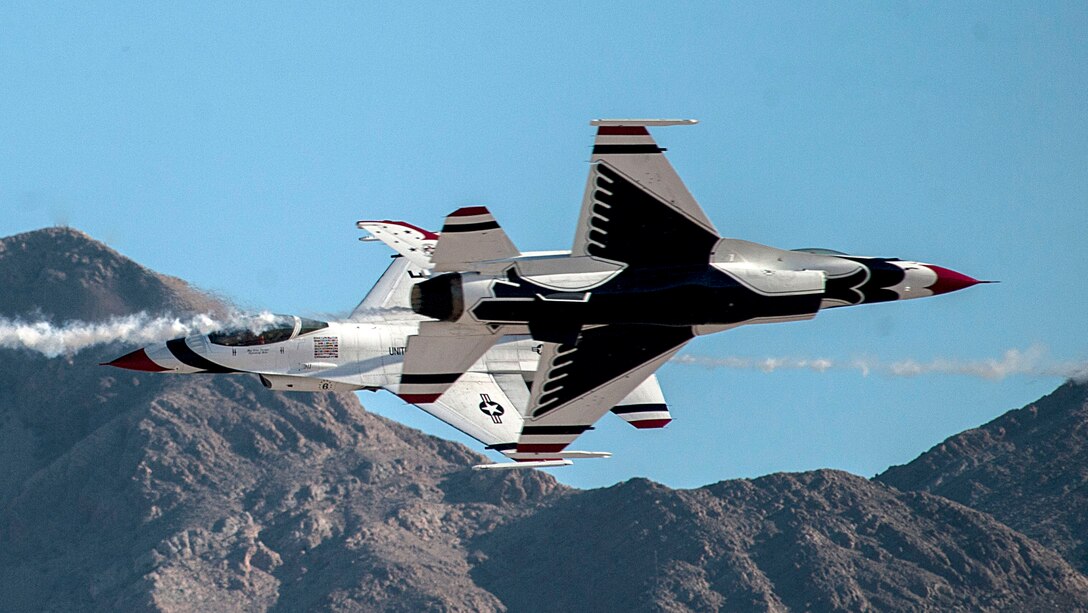 Members of the U.S. Air Force Thunderbirds Air Demonstration Squadron perform stunts during the Aviation Nation air show on Nellis Air Force Base, Nev., Nov. 11, 2016. The Thunderbirds perform precision aerial maneuvers demonstrating the capabilities of Air Force high performance aircraft to people throughout the world. (U.S. Air Force photo by Airman 1st Class Kevin Tanenbaum/Released)