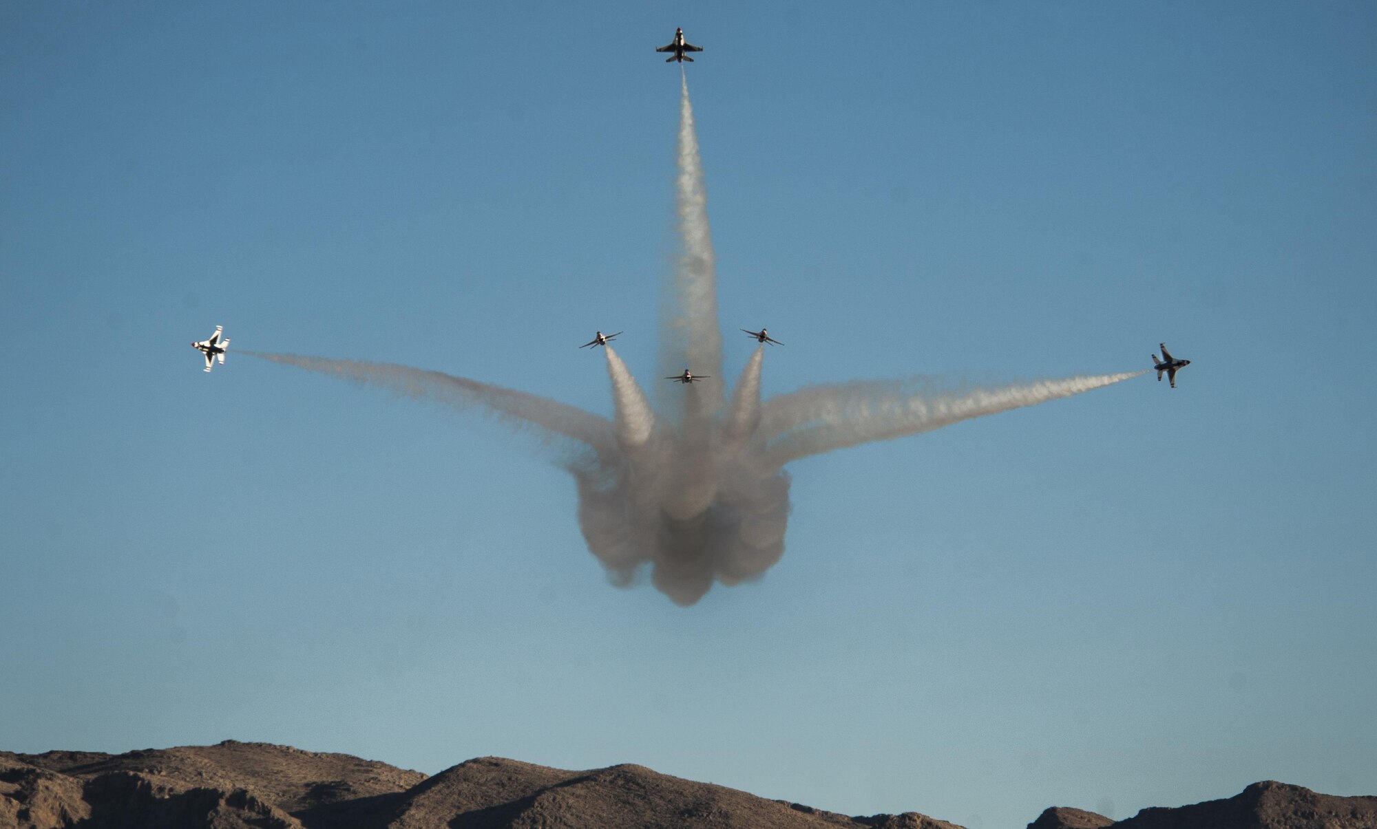 The U.S. Air Force Thunderbirds Air Demonstration Squadron perform the bomb burst maneuver during the Aviation Nation air show on Nellis Air Force Base, Nev., Nov. 13, 2016. The air show brought more than 295,000 spectators from across the globe to experience "75 Years of Air Power." (U.S. Air Force photo by Airman 1st Class Kevin Tanenbaum/Released)