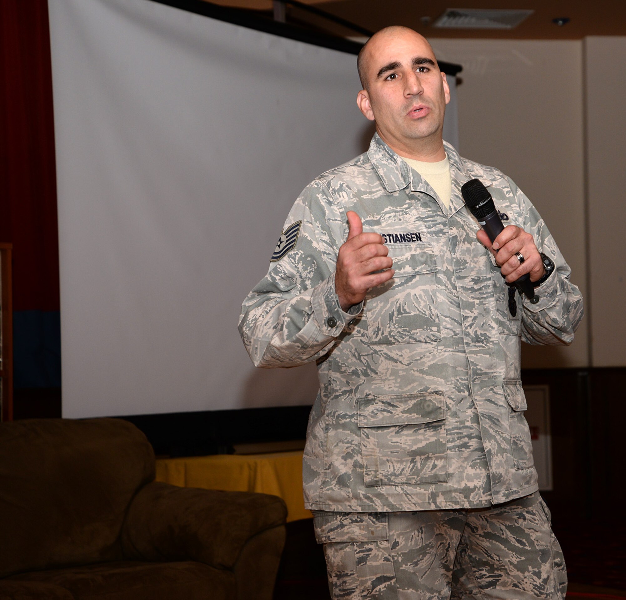 U.S. Air Force Tech. Sgt. Michael Christiansen, 100th Security Forces Squadron flight chief, shares his personal story at the “Storytellers” event Nov. 18, 2016, on RAF Mildenhall, England. Christiansen is a Wounded Warrior and was injured during a series of explosions while deployed, one of which threw him backwards and caused injury to his spine. As he shared his experiences, the flight chief described how hard it is accepting the fact he’s a Wounded Warrior and dealing with the struggles that go along with it, such as being a father and playing with his children. (U.S. Air Force photo by Karen Abeyasekere)