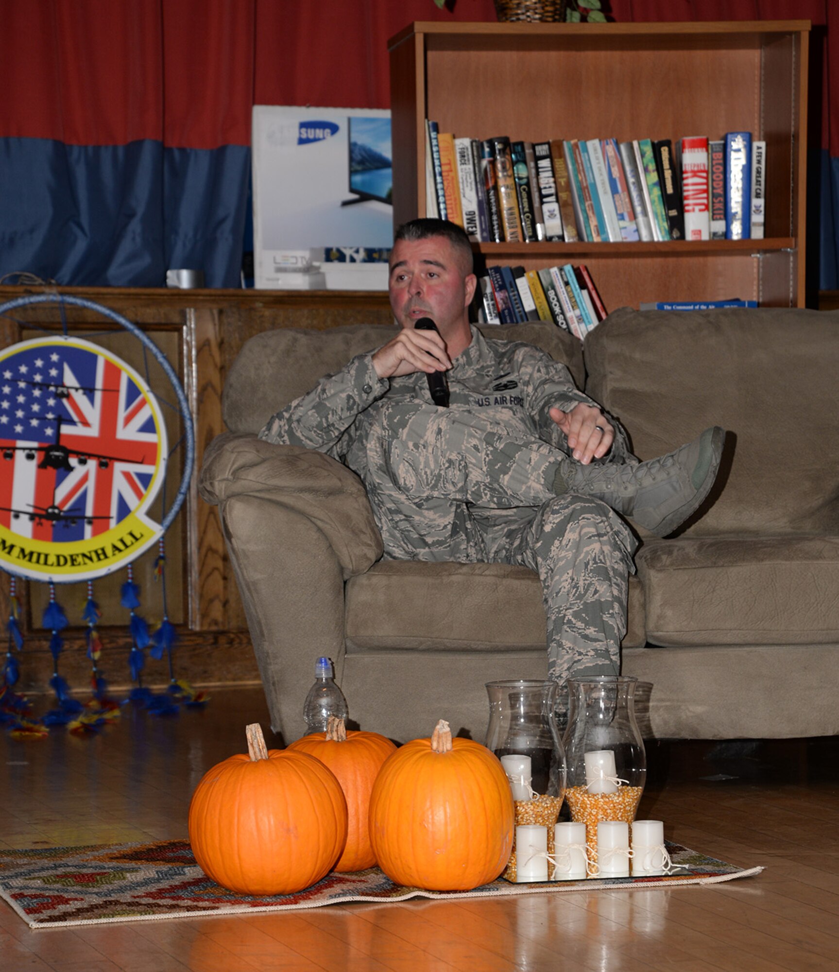 U.S. Air Force Senior Master Sgt. Travis Laws, 100th Logistics Readiness Squadron operations compliance superintendent, shares his personal struggle of post-traumatic stress disorder at a “Storytellers” event Nov. 18, 2016, on RAF Mildenhall, England. Laws was part of a convoy in a deployed location, which left him with PTSD. Laws shared his story of dealing with his PTSD and how he overcame it, with the help of his wife. (U.S. Air Force photo by Karen Abeyasekere)