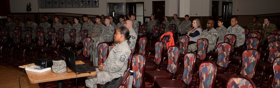 Team Mildenhall members listen to personal accounts of emotional stories from three Airmen at the “Storytellers” event Nov. 18, 2016, on RAF Mildenhall, England. The three Airmen shared their stories of how they overcame struggles with loss, injury and post-traumatic stress disorder. Storytellers was created to encourage Airmen to share their experiences and serves as an avenue to share their paths of resilience with others. (U.S. Air Force photo by Karen Abeyasekere)