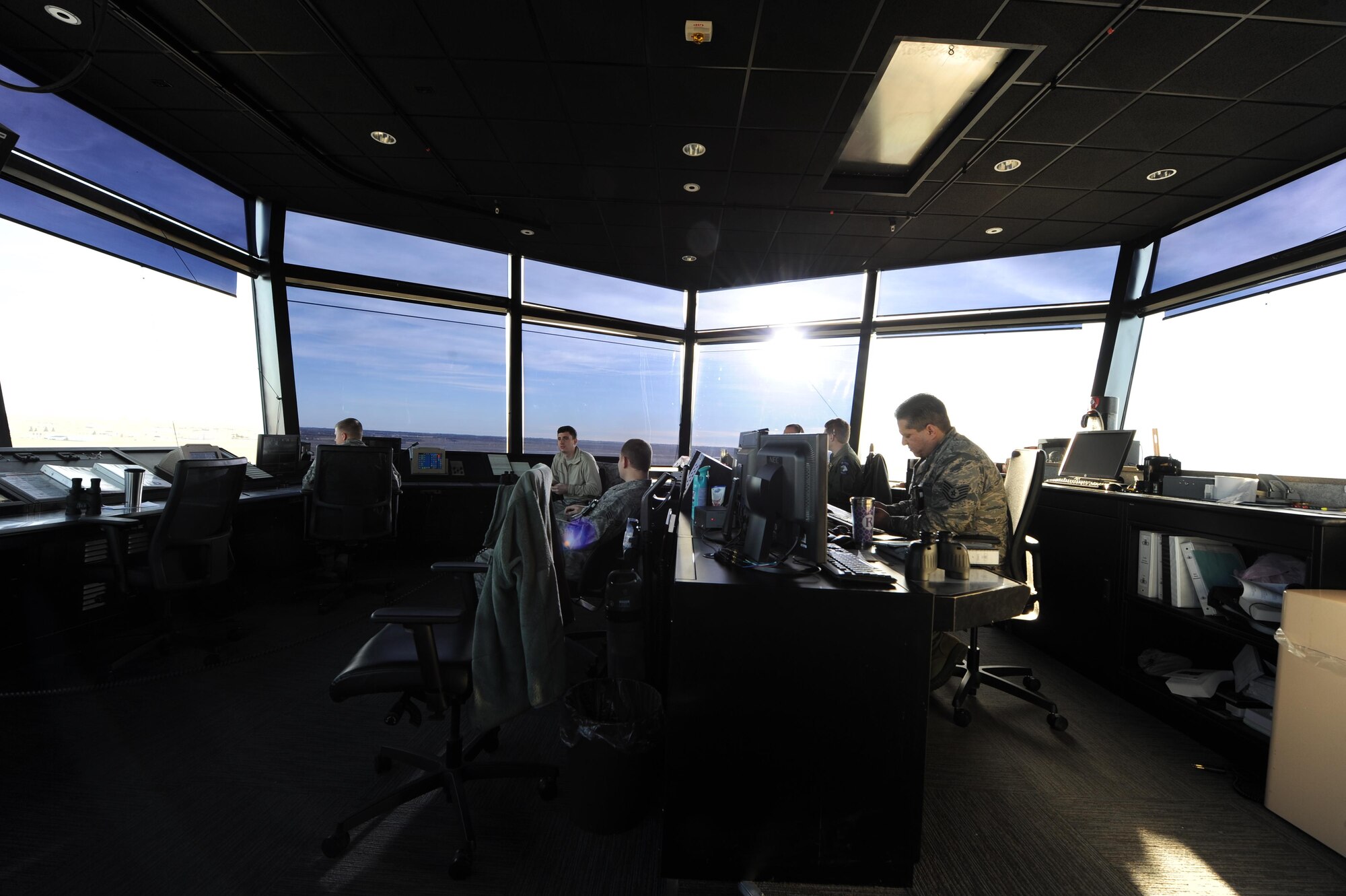 Air traffic controllers from the 5th Operations Support Squadron monitor the flight line at Minot Air Force Base, N.D., Nov. 15, 2016. Controllers are in constant communication with both pilots and ground crew to ensure the safety of aircraft during taxiing, take-off and landing. (U.S. Air Force photo/Senior Airman Kristoffer Kaubisch)