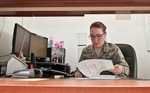 Airman 1st Class Amanda Simpson, 5th Maintenance Group maintenance operations flight time-change monitor, completes paperwork at Minot Air Force Base, N.D., Nov. 15, 2016. Time-change monitors are responsible for documenting all dates and times when aircraft parts are scheduled for an exchange. (U.S. Air Force photo/Airman 1st Class Jonathan McElderry)
