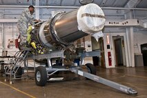 Staff Sgt. Korie Parker, 5th Maintenance Group maintenance operations flight engine trending and diagnostic monitor, inspects a B-52H Stratofortress engine at Minot Air Force Base, N.D., Nov. 15, 2016. These Airmen are responsible for checking all equipment received to ensure no damages occurred during shipment. (U.S. Air Force photo/Airman 1st Class Jonathan McElderry)