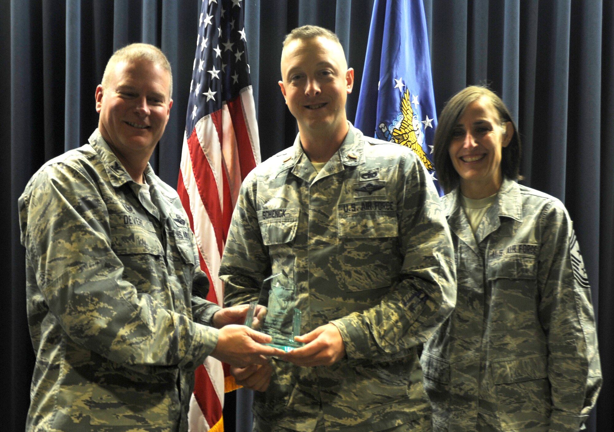 Col. James DeVere, 302nd Airlift Wing Commander, left, presents 2nd Lt. James Schenck with the company grade officer of the quarter award during a presentation Nov. 6, 2016 here. Schenck is the fuels flight officer-in-charge for the 302nd Logistics Readiness Squadron. Other awardees were: field grade officer of the quarter, Lt. Col. Charlotte Appleton, 302nd Aeromedical Staging Squadron; senior noncommissioned officer of the quarter, Senior Master Sgt. Belissa Bermudez, 302nd Airlift Wing; noncommissioned officer of the quarter, Staff Sgt. Nicholas Jamo, 302nd Aircraft Maintenance Squadron; and Airman of the quarter, Senior Airman Anne Lepillez, 731st Airlift Squadron. Also present, 302nd AW Command Chief, Chief Master Sgt. Vicki Robertson.(U.S. Air Force photo/1st Lt. Stephen Collier)