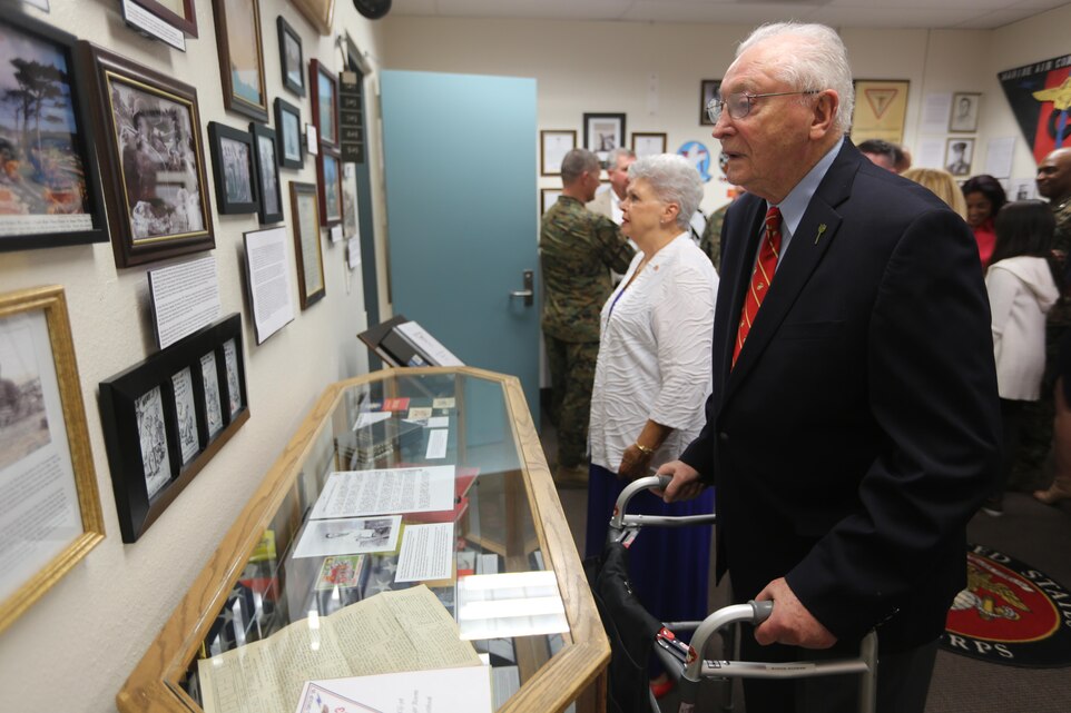 Honored guests and family of Marine Air Control Group (MACG) 38 take in the history of Marine Air Control Group-38’s new heritage room aboard Marine Corps Air Station Miramar, Calif., Nov. 10. The unit’s command built the heritage room so that future Marines may reflect and grow from the unit’s proud history. (U.S. Marine Corps photo by Lance Cpl. Jacob Pruitt/Released)