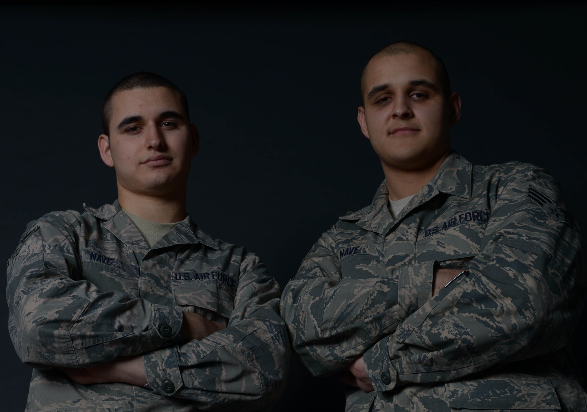 Airman 1st Class Jarrett Nave, 91st Missile Maintenance Squadron electro-mechanical technician and Senior Airman Todd Nave, 91st MMXS missile communications team chief pose for a photo at Minot Air Force Base, N.D., Nov. 15, 2016. (U.S. Air Force photo/Senior Airman Apryl Hall)