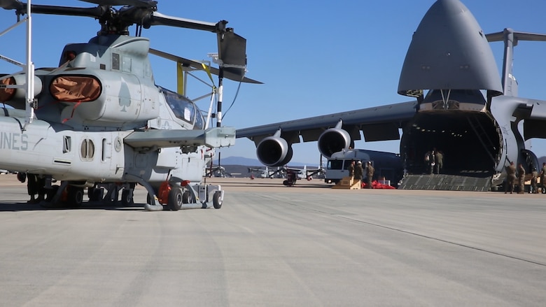 An AH-1Z Viper with Marine Light Attack Helicopter Squadron (HMLA) 267 is prepared to be transported on a C-17 Globemaster III aboard Marine Corps Air Station Miramar, Calif., Nov. 10. HMLA-267 deployed to MCAS Futenma, Okinawa, Japan, in November. (U.S. Marine Corps photo by Pfc. Liah Kitchen/Released)