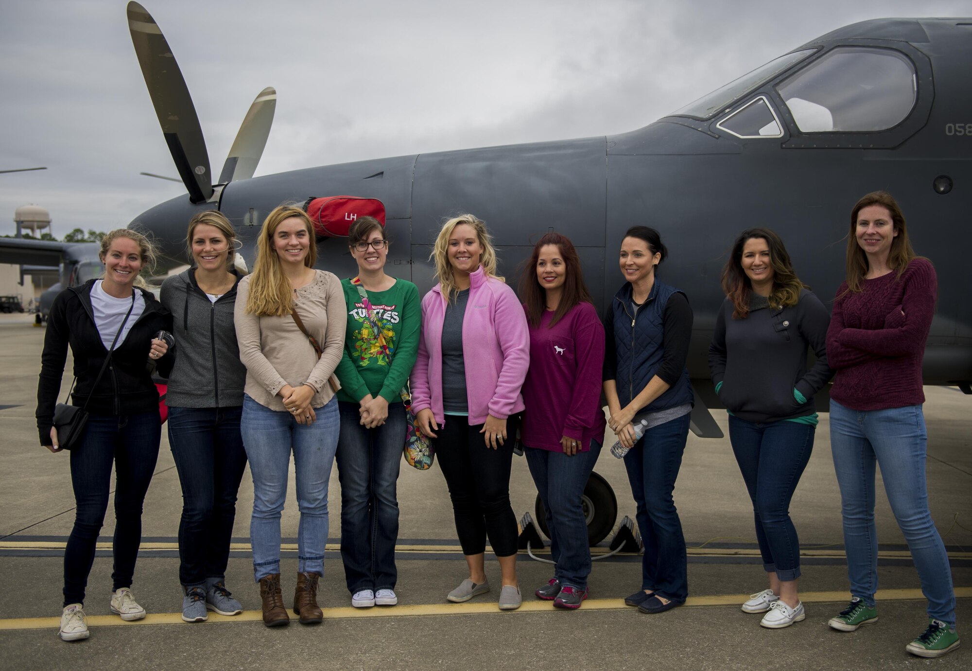 Air Commando spouses stand in front of a U-28A during a Spouses Flight tour at Hurlburt Field, Fla., Nov. 19, 2016. Spouse’s toured static displays of different 1st Special Operations Wing aircraft to get a firsthand look at the capabilities of the 1st SOW. (U.S. Air Force photo by Airman 1st Class Isaac O. Guest IV)