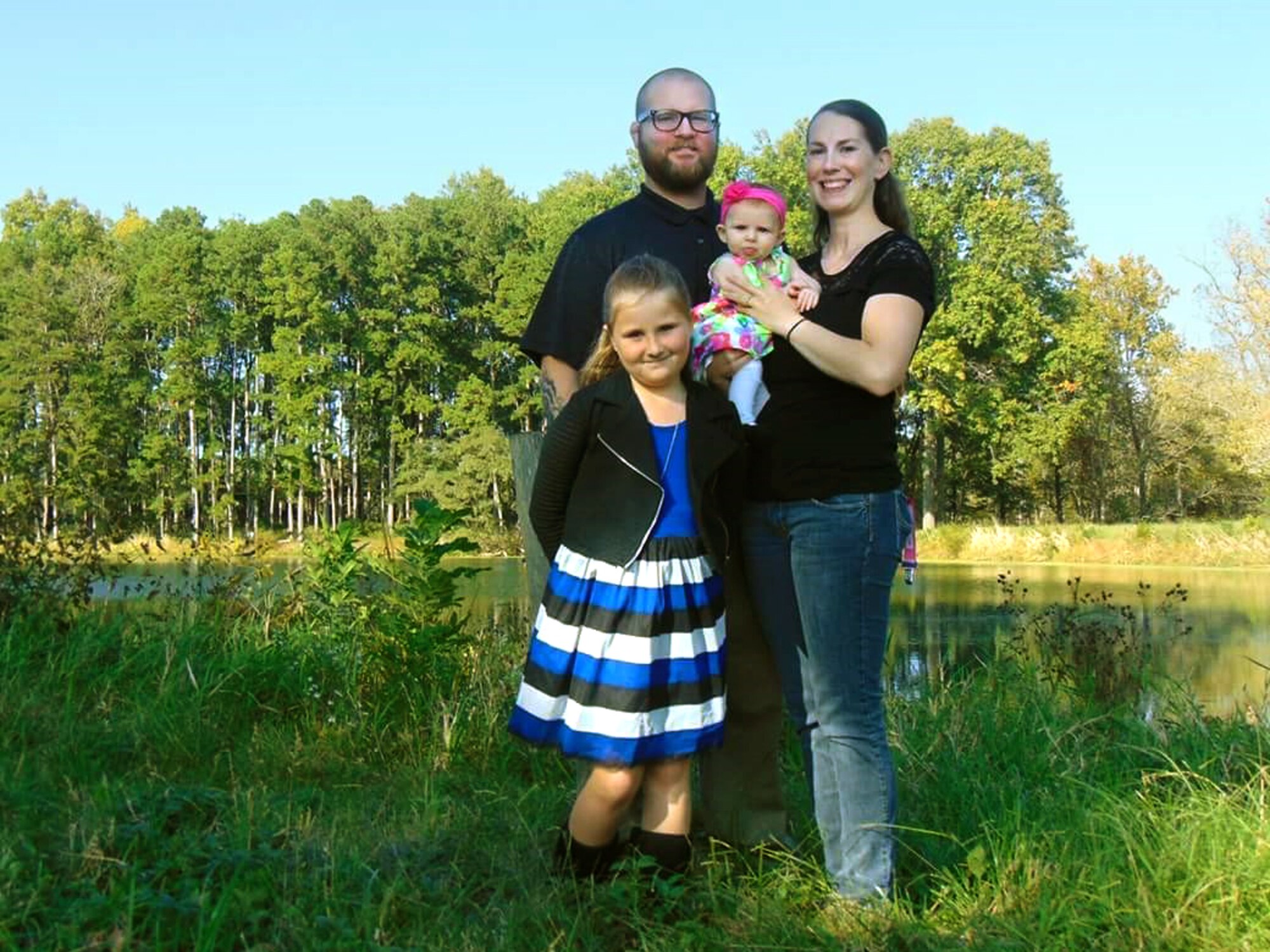 John and Staff Sgt. Shalon Sabo with their daughters Kayleigh, 8, and Avery, 5 months.