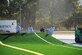 Contractors lay new turf at the Robins Fitness Center's track field across from the center. The entire area is being reconstructed and is scheduled to be complete around the beginning of the new year. (U.S. Air Force photo by Misuzu Allen)