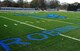 Contractors lay new turf at the Robins Fitness Center's track field across from the center. The entire area is being reconstructed and is scheduled to be complete around the beginning of the new year. (U.S. Air Force photo by Misuzu Allen)