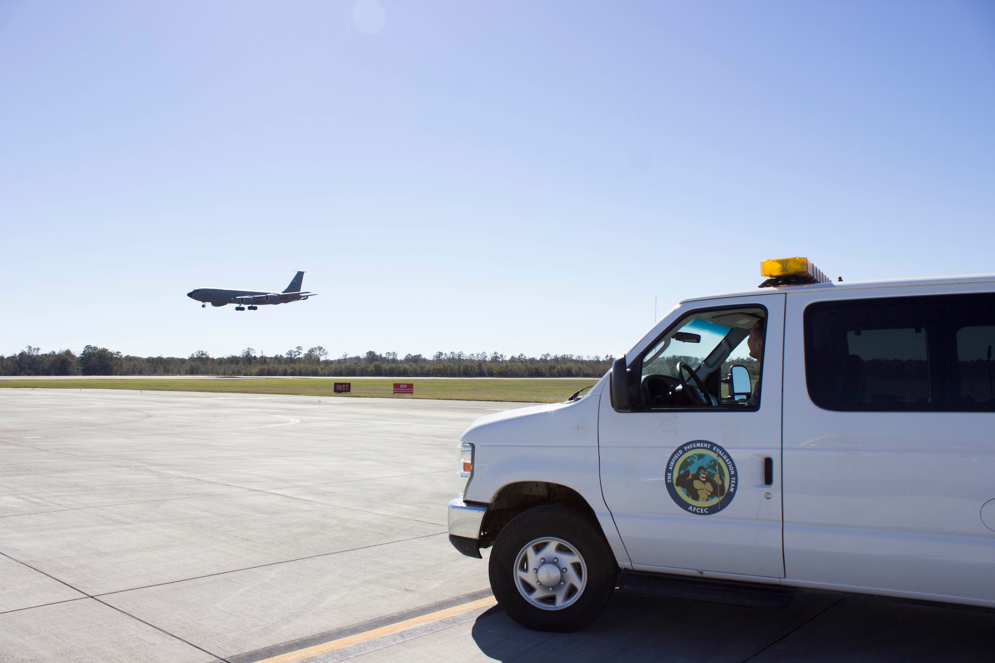 Master Sgt. Robert Hidalgo waits for a KC-135 to land during a recent airfield pavement evaluation at Seymour Johnson Air Force Base, North Carolina. The team traveled to the base as part of Hurricane Matthew response efforts requested by the base. (U.S. Air Force Photo/Susan Lawson)