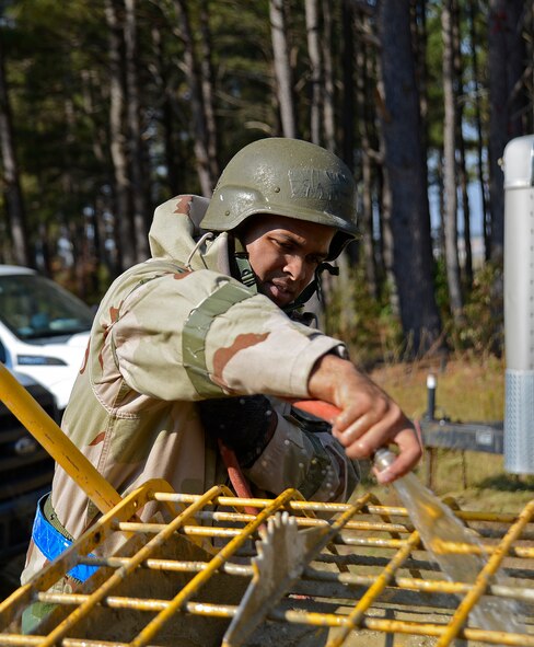 U.S. Air Force Senior Airman Jeff Snead, Jr., 20th Civil Engineer Squadron structural journeyman, adds water to sand and minerals to make mortar at Shaw Air Force Base, S.C., Nov. 16, 2016. During operational readiness exercise Weasel Victory 17-03, Airmen continued normal operations while adhering to Mission Oriented Protective Posture levels. (U.S. Air Force photo by Airman 1st Class BrieAnna Stillman)