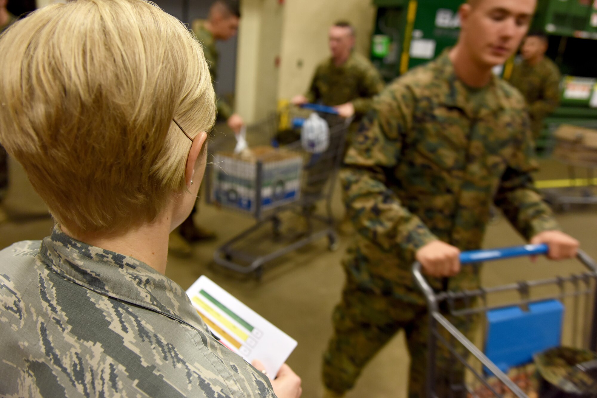 U.S. Air Force Master Sgt. Brenda Dodson, 315th Training Squadron first sergeant, tracks the number of boxes each squadron gets for Operation Warmheart inside the commissary on Goodfellow Air Force Base, Texas, Nov. 22, 2016. First sergeants signed up service members to received free Thanksgiving items such as turkey and powdered mashed potatoes, which they later distributed. (U.S. Air Force photo by Senior Airman Joshua Edwards/Released)