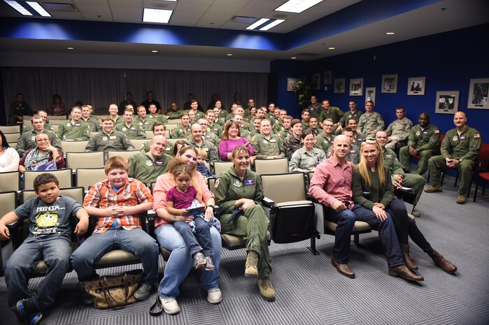 Brett Gardner, New York Yankees outfielder, and his wife, Jessica, both bottom right, sit with the members of the 15th Airlift Squadron Nov. 21, 2016. Gardner visited Joint Base Charleston to boost morale and offer thanks to the military men and women who are serving. Gardner and his wife toured the inside a C-17 Globemaster III and, later, hosted an early Thanksgiving catered potluck event for the squadron.