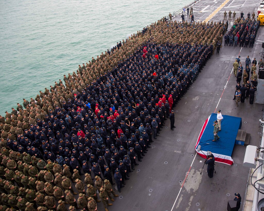 USS MAKIN ISLAND, Singapore (November 22, 2016) Marines and Sailors with Makin Island Amphibious Ready Group/11th Marine Expeditionary Unit stand in formation on the flight deck of the USS Makin Island (LHD 8) while the ship’s commanding officer Capt. Mark Melson, introduces the Secretary of the Navy, The Honorable Mr. Ray Mabus, while moored at Changi Naval Base, Singapore, Nov. 22, 2016. Mabus visited with the Marines and Sailors of the ARG/MEU and gave them insight on the future of the Navy and Marine Corps matters such as fleet size, physical fitness standards and family readiness. (U.S. Marine Corps photo by Lance Cpl. Brandon Maldonado/Released)
