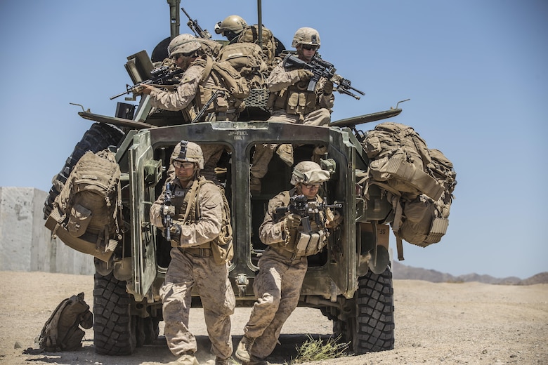 Marines dismount from a Light Armored Reconnaissance Vehicle to raid a compound during the 11th Marine Expeditionary Unit’s Combined Arms Exercise at Marine Corps Air Ground Combat Center Twentynine Palms, Calif., June 12, 2016. Well-planned and aggressive training like this prepares the individual Marine to fulfill their role on the team, which in turn builds unit cohesion and increases the speed of mission accomplishment. MEUCAX is conducted to maintain a high level of combat readiness prior to the MEU’s Western Pacific 16-2 deployment later this year. The Marines are with LAR Company, Battalion Landing Team 1st Bn., 4th Marines, 11th MEU. (U.S. Marine Corps photo by Lance Cpl. Zachery Laning/Released)
