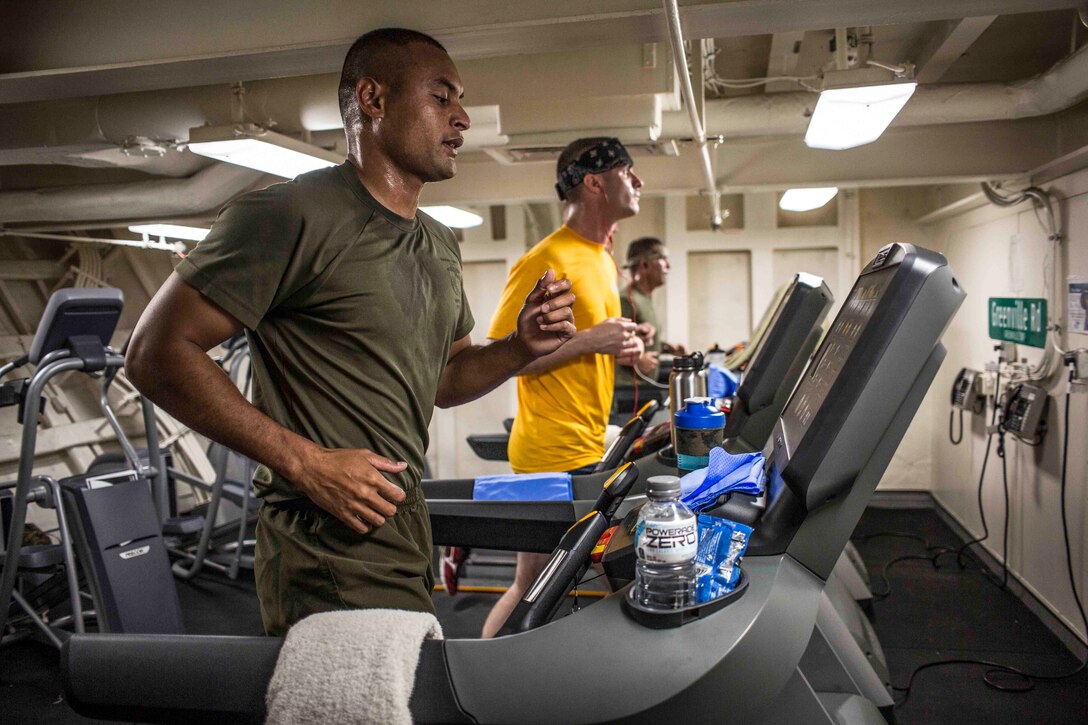 USS SOMERSET, At sea – (Oct. 30, 2016) Marines and a sailor participate in the 41st Marine Corps Marathon aboard the USS Somerset Oct. 30, 2016 at sea. The Marine Corps Marathon organization makes special considerations allowing Marines and Sailors who are deployed to officially run the marathon wherever they are in the world, even on an amphibious landing dock ship. The Marines and Sailor are with the 11th Marine Expeditionary Unit/Makin Island Amphibious Ready Group, currently underway during their Western Pacific 16-2 deployment. (U.S. Marine Corps photo by Lance Cpl. Zachery C. Laning/Released)