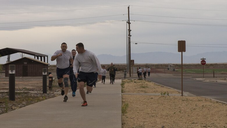 Participants race to the finish line during the 49th Force Support Squadron’s annual Turkey Trot on Nov. 21, 2016 at Holloman Air Force Base, N.M. The first, second, and third place winners were Thomas, Keonte, with the 49th Civil Engineer Squadron, and Michael, with the 54th Aircraft Maintenance Squadron, respectively. (U.S. Air Force photo by Airman 1st Class Alexis P. Docherty. Last names are being withheld due to operational requirements.) 