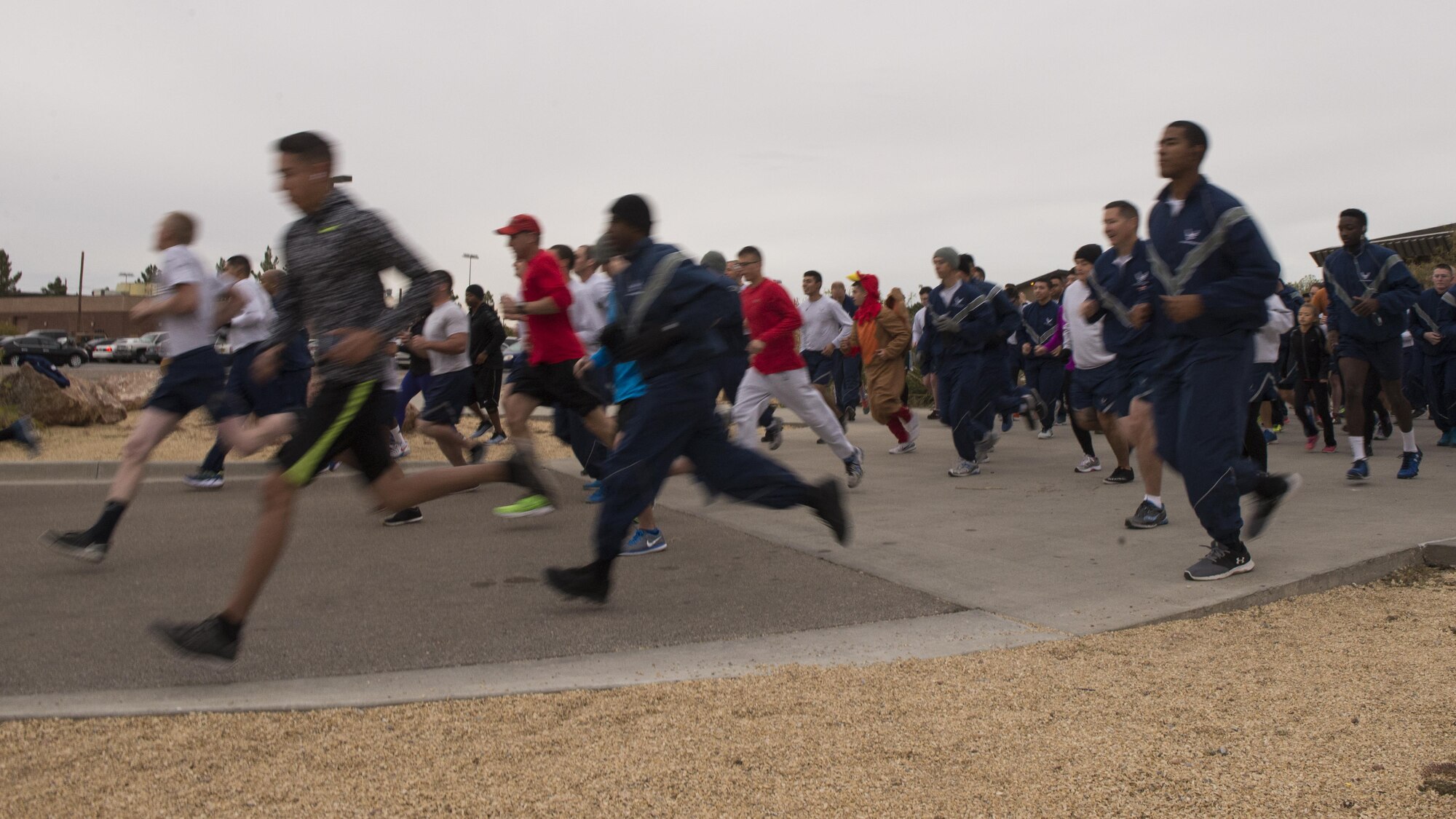Participants race in the 49th Force Support Squadron’s annual Turkey Trot on Nov. 21, 2016 at Holloman Air Force Base, N.M. 150 Airmen and their families competed in the race. (U.S. Air Force photo by Airman 1st Class Alexis P. Docherty) 