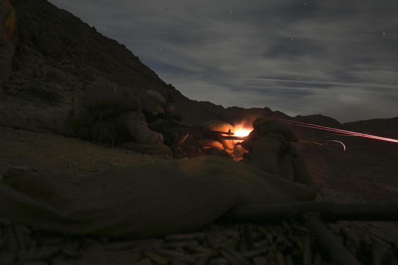 Machine gunners with 1st Battalion, 7th Marine Regiment, fire an M240B medium machine gun at a target at Range 400 aboard Marine Corps Air Ground Combat Center, Twentynine Palms, Calif., during the unit’s night-time combined arms live-fire exercise Nov. 16, 2016. (Official Marine Corps photo by Cpl. Julio McGraw/Released)